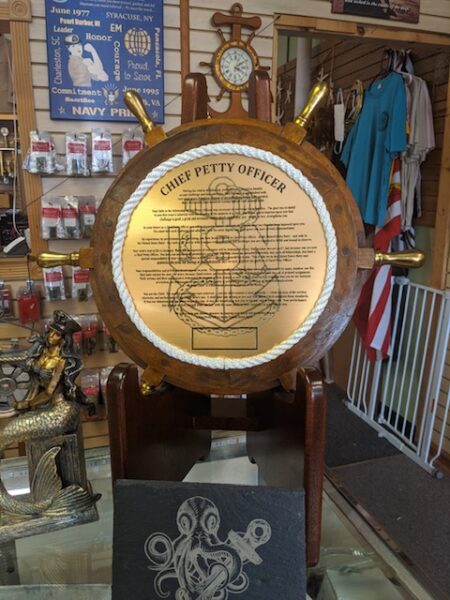 CPO CREED ON 18" SHIPS WHEEL WITH BRASS SPOKES